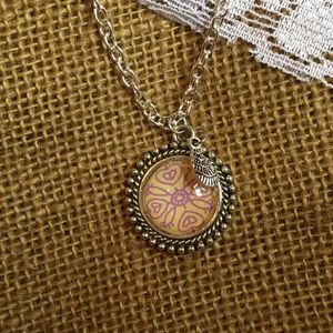 Circle pendant necklace with charm